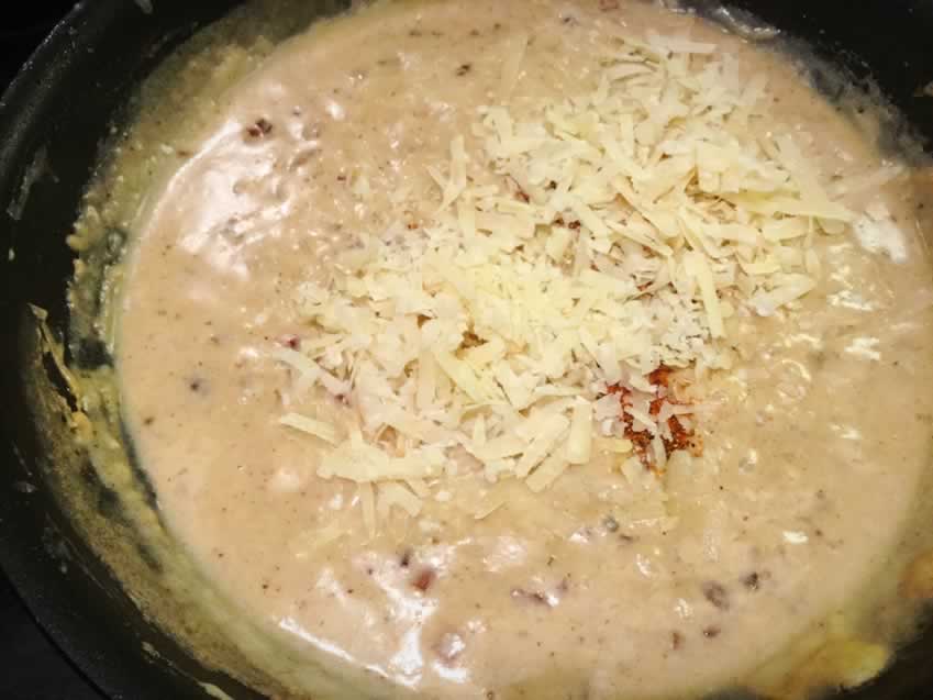 Making the parmesan cream sauce in a saute pan