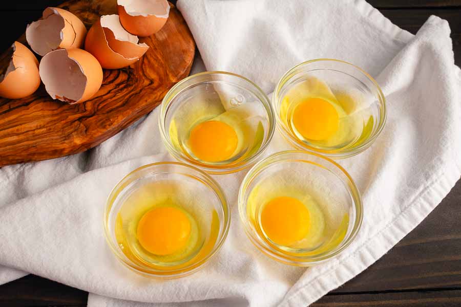 Cracked eggs in prep bowls