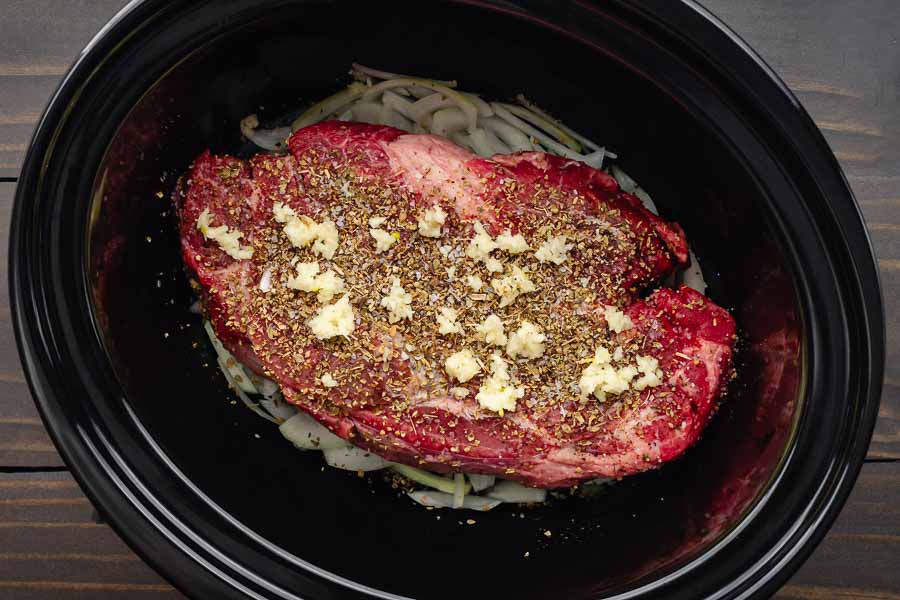 Seasoned chuck roast in slow cooker