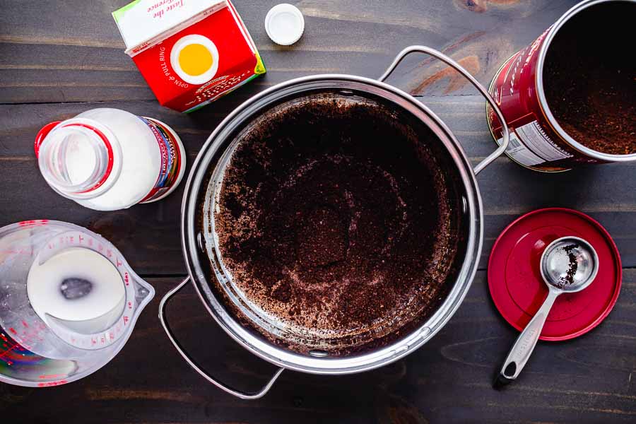 Vietnamese coffee grounds, whole milk, and heavy whipping cream in a 2-quart pan