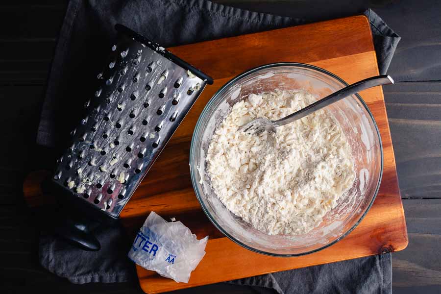 Grated frozen butter mixed into dry crust ingredients