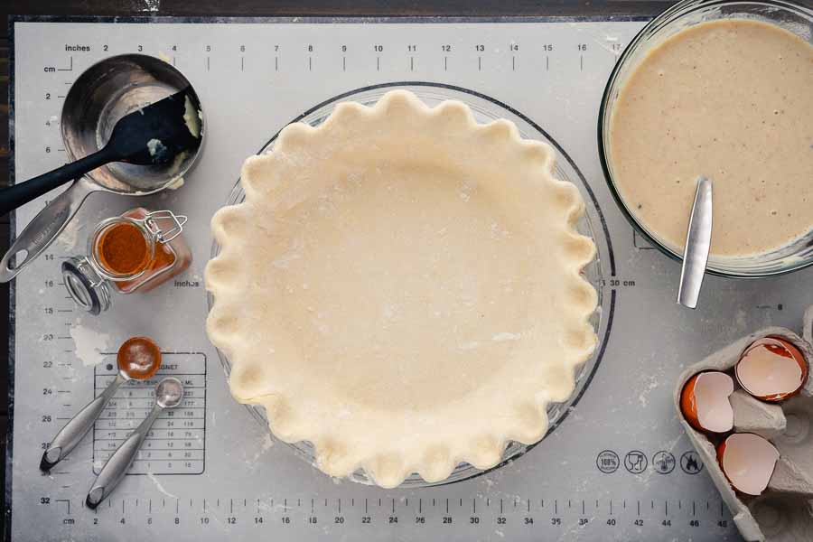 Freshly made pie crust with fluted edges