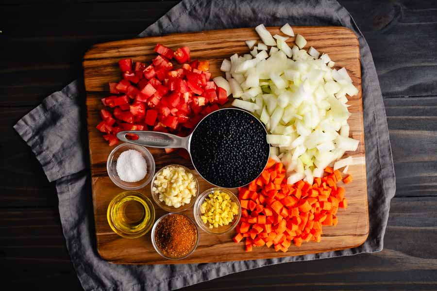 Prepped and measured lentils, vegetables, and spices