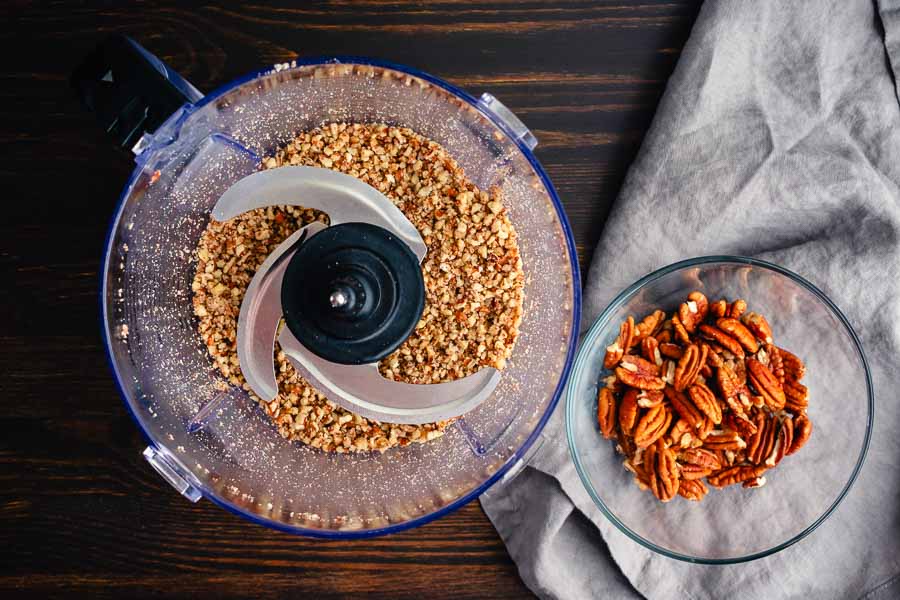 Finely ground pecans in a food processor