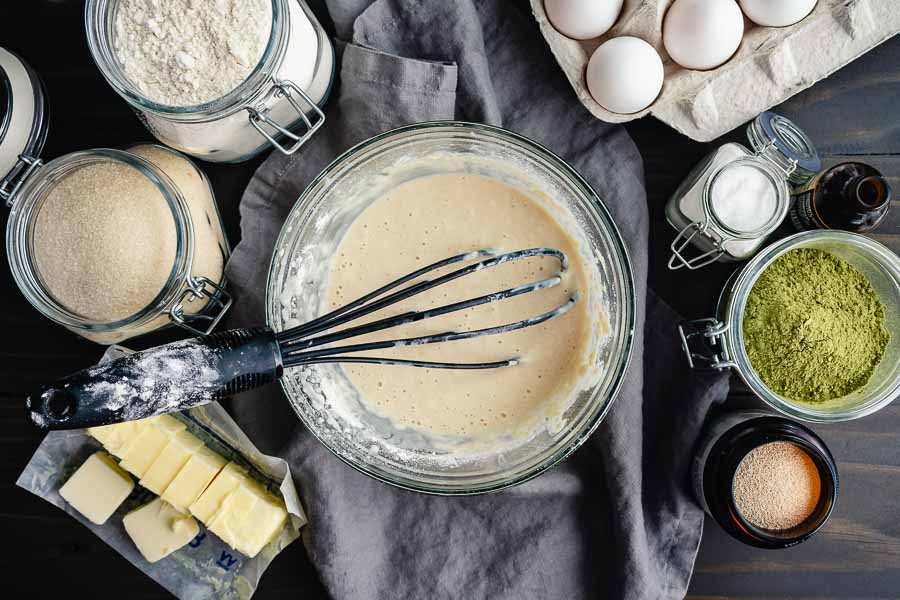 Flour whisked into warm milk and yeast mixture