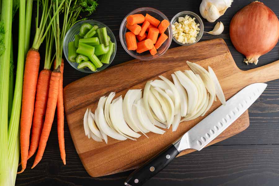 Prepping the onion, celery, carrots, and garlic