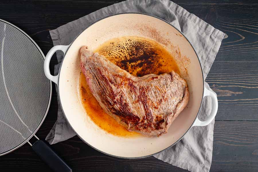 Seared tri-tip in a braising pan