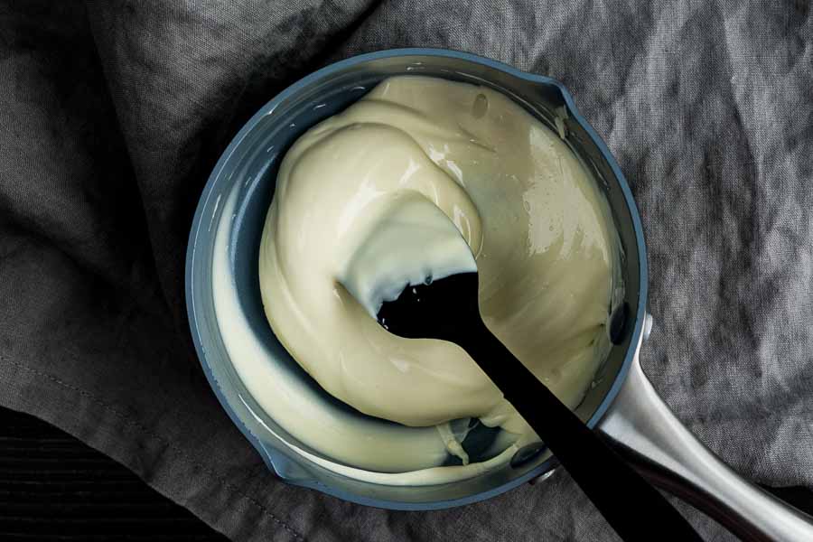 Melting the white chocolate in a small saucepan